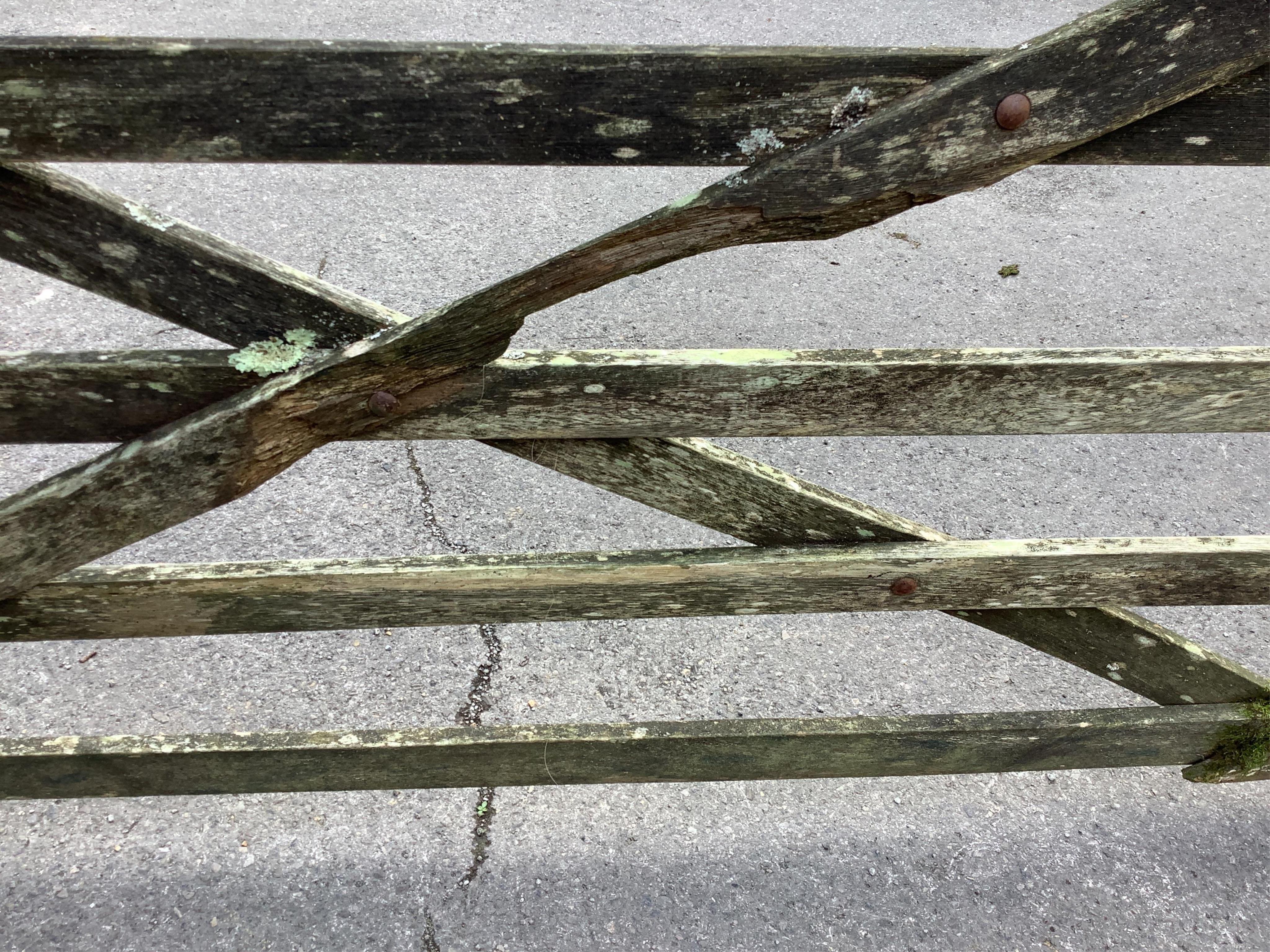 A pair of 12ft Biddenden hardwood gates with galvanised mounts. Condition - poor to fair